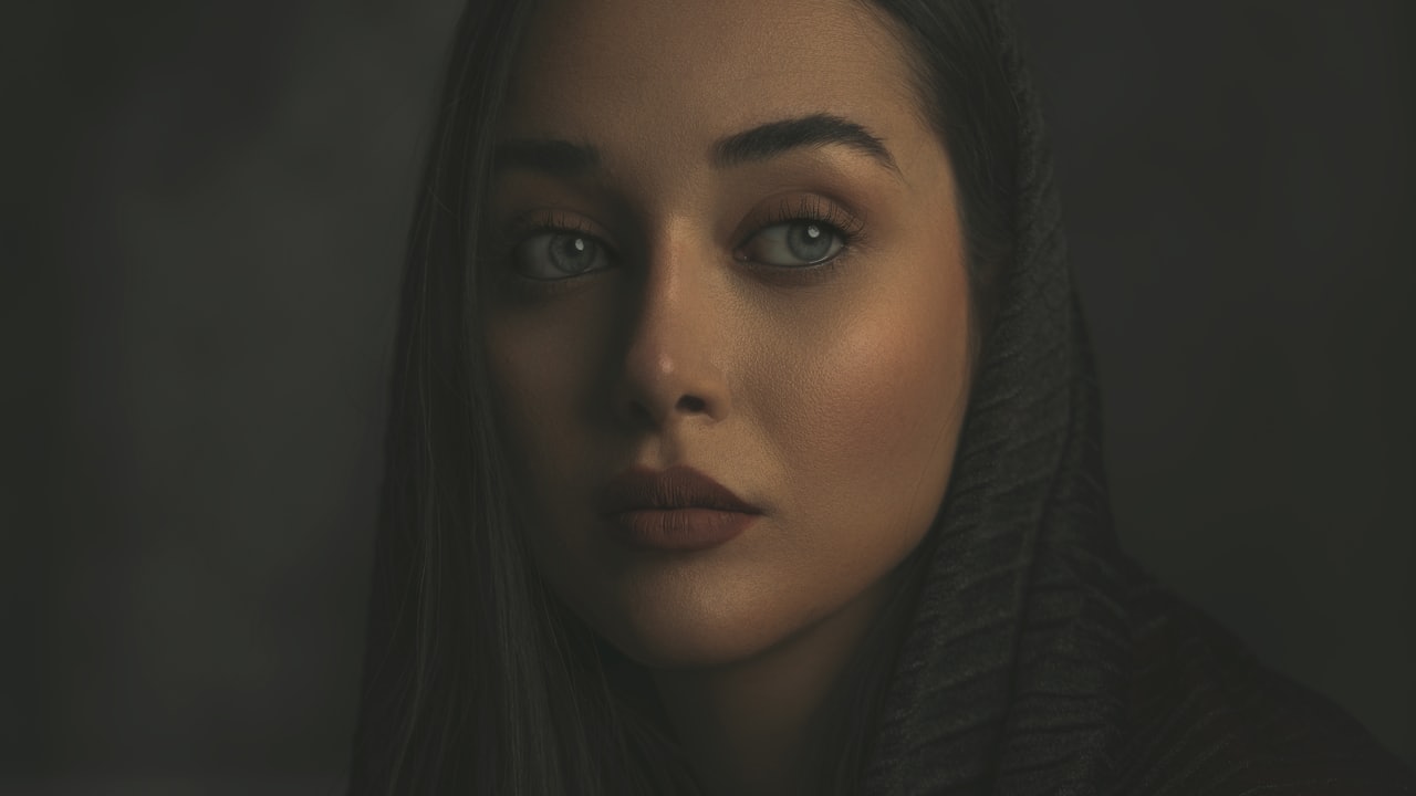 A portrait in warm, low-key light